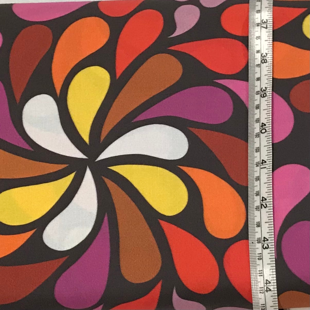 In a Spin - large, 1970s festival colours